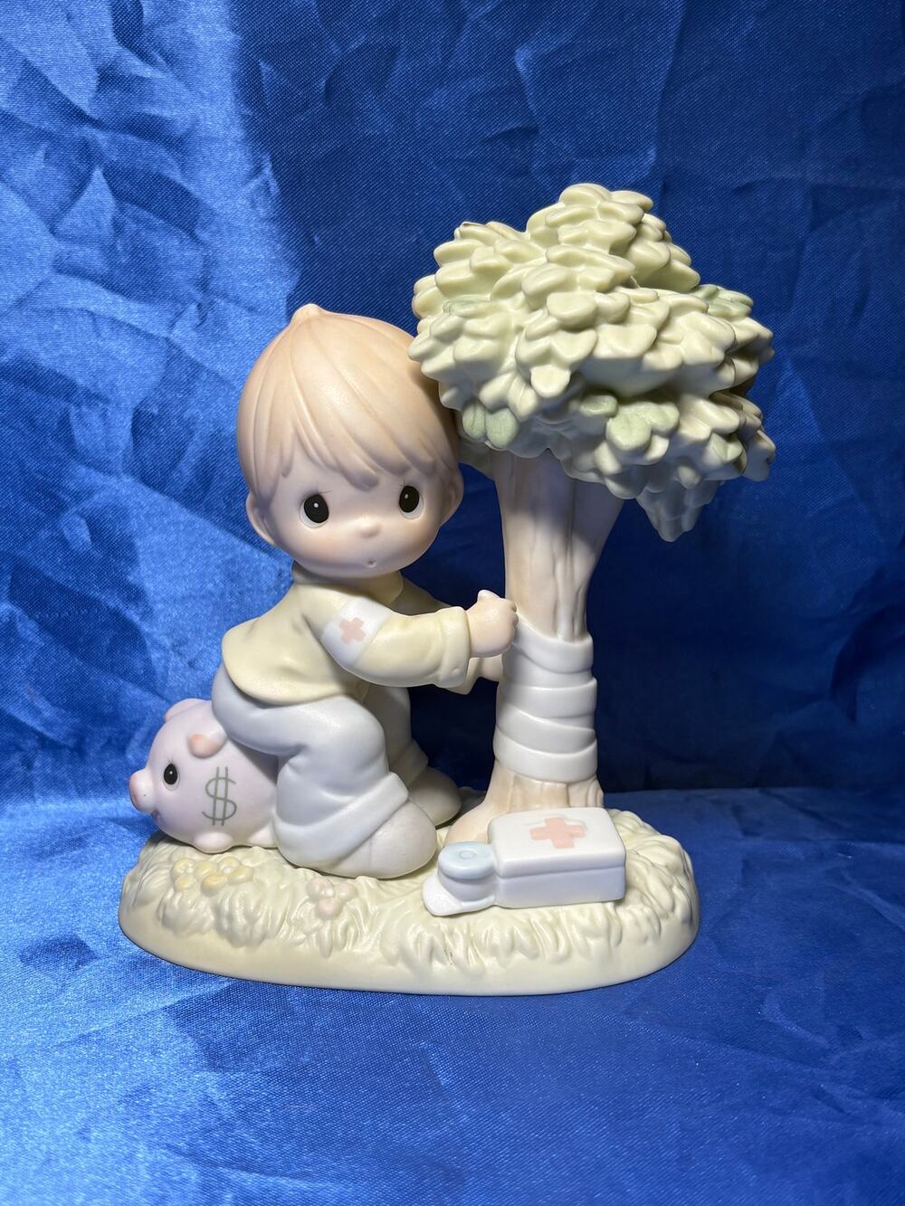 Precious Moments Boy Hugging Tree Money's Not the Only Thing Worth Saving